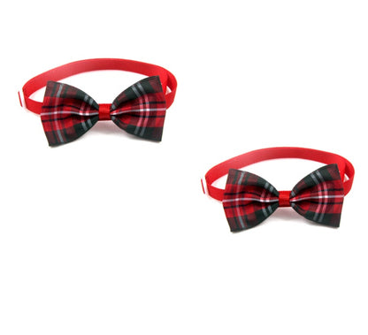 Two plaid pet bow ties with red elastic straps and bow center knot