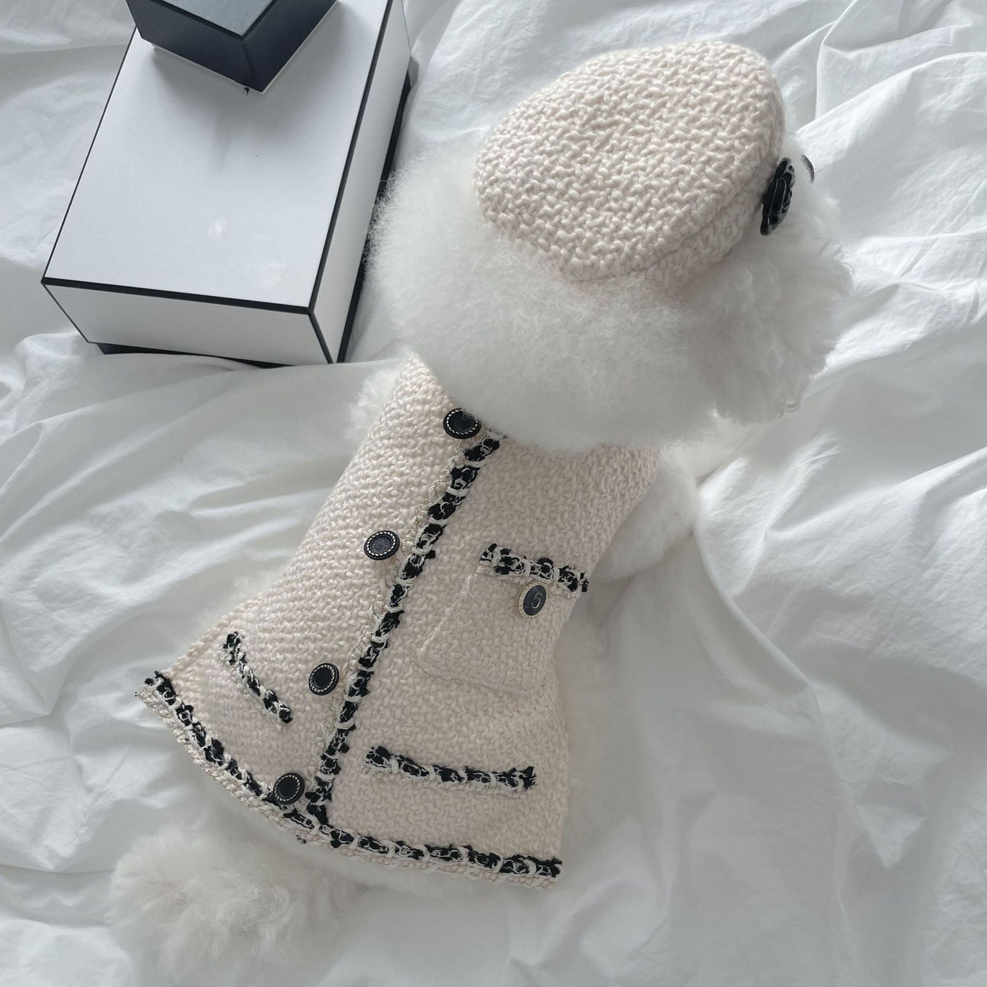 Pet knitted beanie hat in beige with black floral trim and button accents