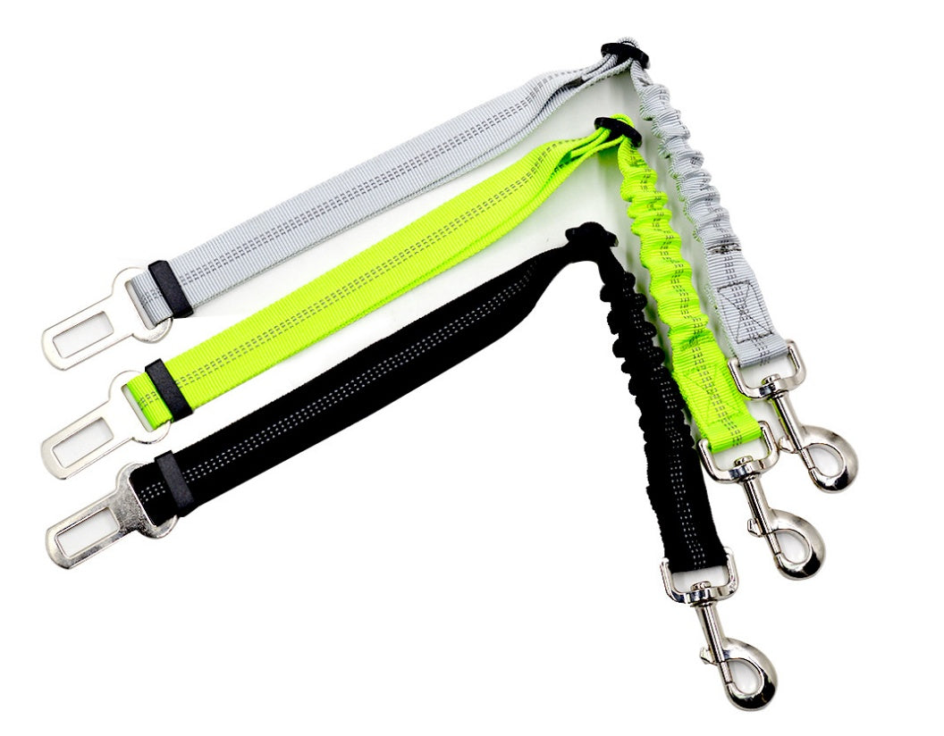 Reflective dog car seat belt with light grey strap, neon green panel, and metal clips.