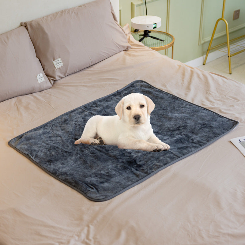 Navy blue waterproof pet blanket with dark trim edge, dog resting on it