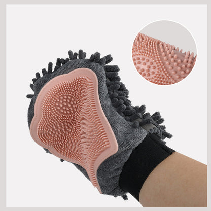 Pink silicone bristle side on gray grooming glove for brushing and massaging