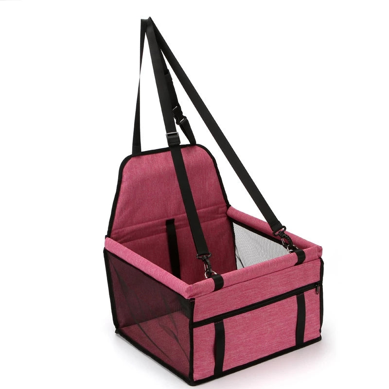 Pink foldable pet safety seat car bag with padded sides and adjustable safety straps