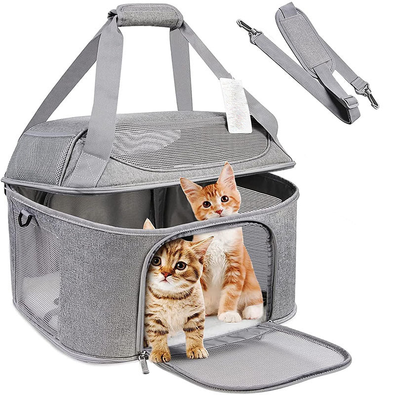 Gray pet carrier with top handle and shoulder straps; open front shows mesh side panels