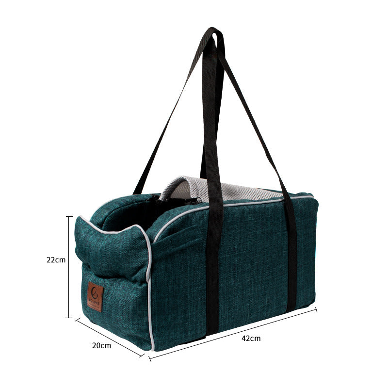 Dark blue pet tote bag with black webbing straps and rounded top edge