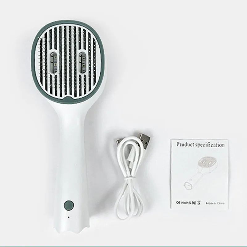 UVC pet comb brush with power cable and instruction card, white handle and dark rim