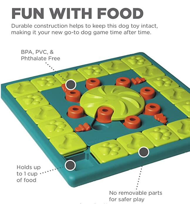 Top view of dog puzzle feeding toy with central treat wheel and red ring pieces