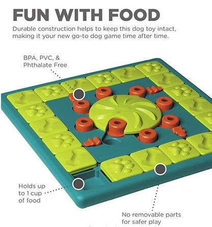 Top view of dog puzzle feeding toy with central treat wheel and red ring pieces
