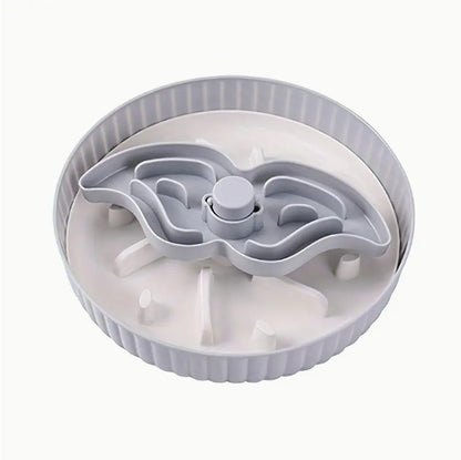 Light gray rotating slow-feeding board with central spinner and channels