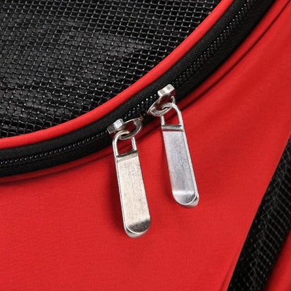 Red puppy carrier backpack close-up of front mesh panel and zipper pull loops