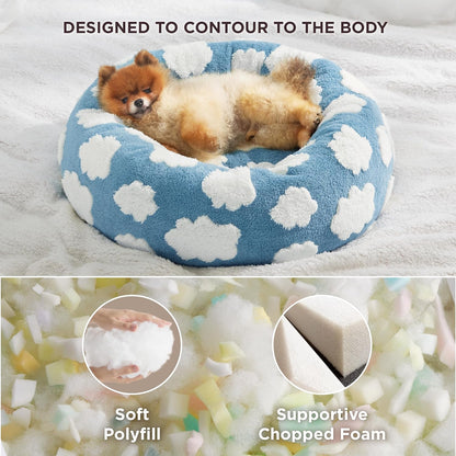 Blue donut-style pet bed with white cloud spots, soft plush interior