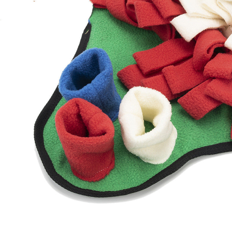 Close-up of green sniffing pad with red, blue and white fleece loops